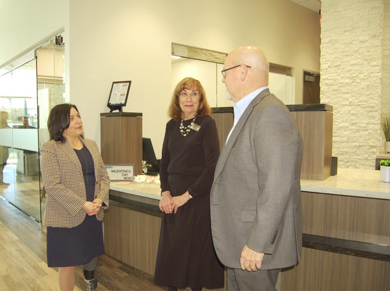 Pictured at the soft opening of the newly re-built Woodforest National Bank building in Downtown Conroe are bank representatives Julie Mayrant, President of Retail Division and Chief Retail Officer; Linda O’Dell, Conroe Downtown Branch Manager; and Jay Dreibelbis, President and CEO. (Photo by Liz Grimm)
